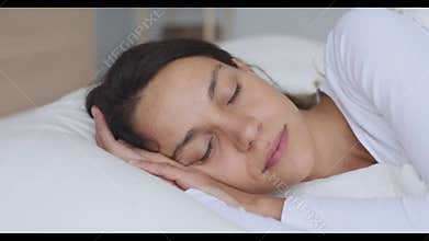 Serene calm young mixed race woman sleeping well.