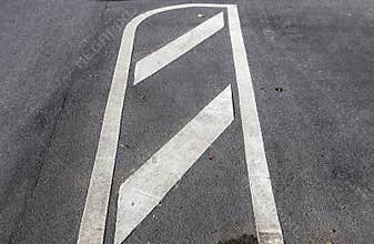 Different signs and marking painted on the ashpalt of streets and roads