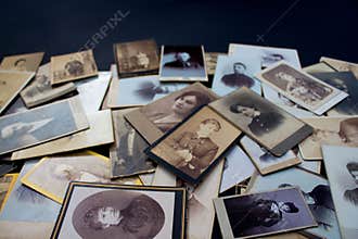 Stack of original photos circa 1870-1920 with copy space for your logo or text. Genealogy research