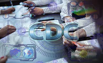 A team of doctors works with a futuristic hologram of cdc technology. The concept of disease control and prevention centers