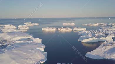Iceberg at sunset. Nature and landscapes of Greenland. Disko bay. West Greenland. Summer Midnight Sun and icebergs. Big blue ice