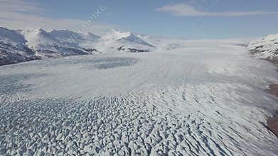 Aerial: Close up of Largest Glacier in Europe Vatnajokull. Beautiful glaciers flow through the mountains in Iceland.