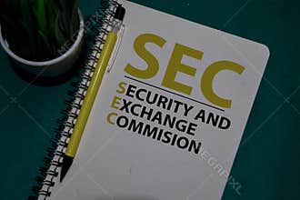 SEC - Security and Exchange Commision acronym write on a book isolated on Office Desk