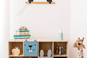 Cute interior of kid room with baby accessories and toys.