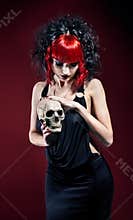 Elegant gothic woman with skull