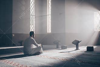 Quran - holy book of Islam mosque Muslim in mosque enuntiat Quran in Ramadan