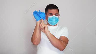 The manual how to remove gloves and a mask to avoid infection with coronavirus COVID-19. Precaution to not to infect