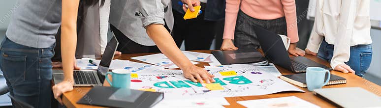 Young Asian creative team work together in business brand design project brainstorm meeting. Modern office, colleague coworker