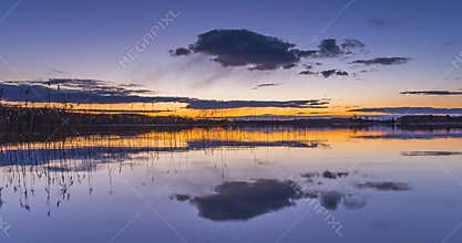 Calm lake water in the evening blue hour