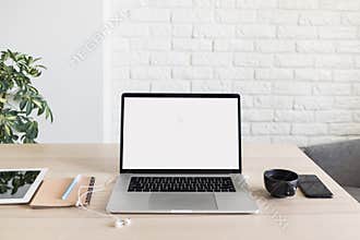 Place of work, home office, laptop computer, notebook, coffee cup, smartphone at desk