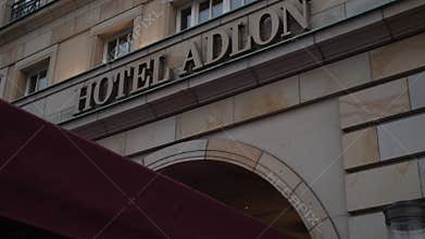 Close up of fancy Hotel Adlon Kempinski Sign, Entrance in Berlin, Germany