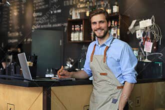 Small business owner working at his cafe
