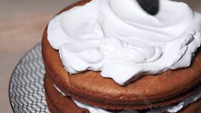 Summer sponge cake with whipped cream. Cooking cake - spreading cream.