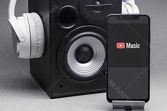 Mobile phone with Youtube Music logo on screen, Stream Songs and Videos app. Belgorod , Russia - APR, 16, 2020