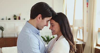 Happy family couple enjoying free tender romantic moment at home.