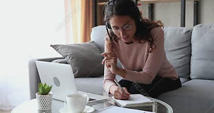 Happy young female student holding video call with teacher.