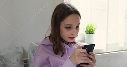 Happy adolescent girl received sms with good news.