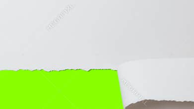 Female hand tearing off part of white cardboard banner, concept advertising, revealing green screen with copy space