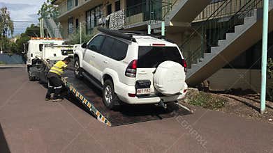 Car towing service truck towing a vehicle