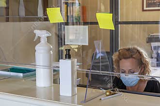 The new way of working imposed by the needs to avoid possible contagions from Covid-19 coronavirus, with plexiglass screen a