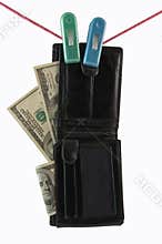 Money and Purse Hanging on a Clothesline