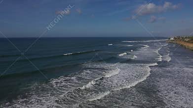 Aerial Carlsbad California beach surfers cliff coast 4K