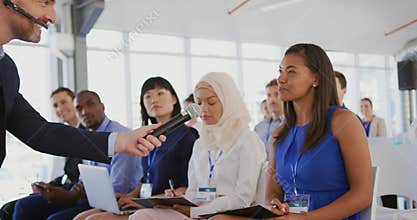 Woman answering at a question during a seminar