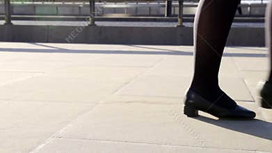 Low angle of people walking on street in London