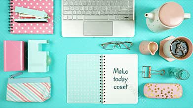 Desktop workspace with hi-tech laptop and modern colorful accessories.
