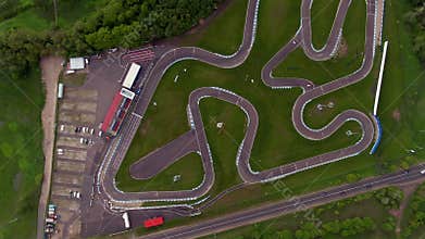 High altitude flight over the sports car race track on the river bank