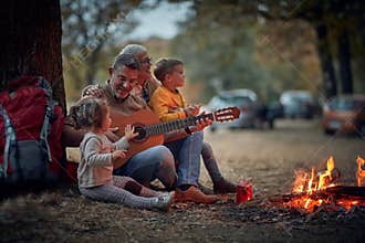 Grandparents singing with grandchildren; Quality family time concept