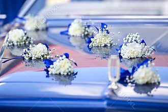 Anniversary flowers on a car.