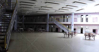 Pan across common room of prison