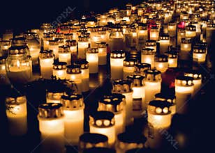 Large amount of lit grave candles at All Saints Day.