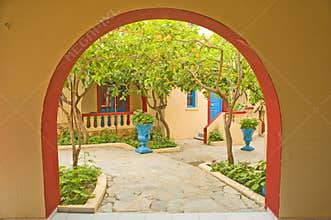 Lemon trees seen through an arch.