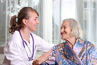 Smiling doctor takes care the senior