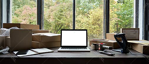 Table with laptop mock up screen and boxes, ecommerce online store shipping.