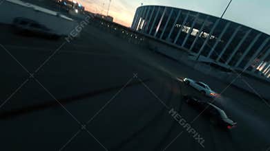 Sports cars drive drifting on empty plain road in night city