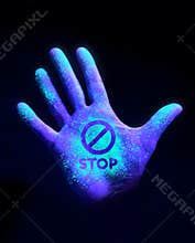 Hand Glowing With Ultra Violet Light Showing Bacteria