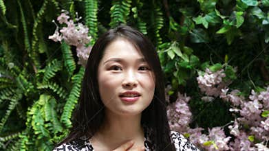 Chinese woman showing emotions for happiness