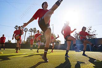 Womens Football Team Training For Soccer Match On Outdoor Astro Turf Pitch