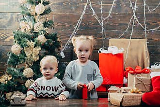 Winter evening at home. Winter kids. Christmas Xmas winter holiday concept. Christmas tree decoration. Cute little child