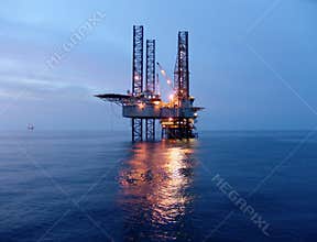 Oil rig before sunrise