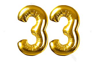 Happy 33 years old party with golden shiny inflatable balloons isolated
