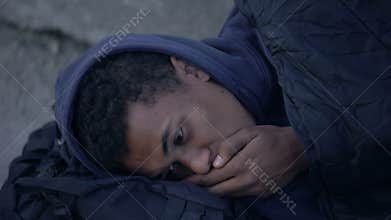 Sick coughing homeless man sleeping outdoors, social insecurity, poverty despair