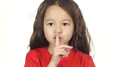 Close-up girl shows emotion of silence at white background. Slow motion