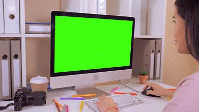 Designer typing on pc