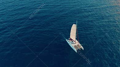 Aerial view. Large sailing catamaran in the open sea.