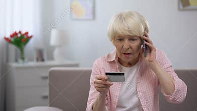 Confused senior woman with credit card calling bank support, online fraud victim
