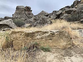 Gobustan, Azerbaijan, September, 11, 2019.  Ancient petroglyphs in Gobustan, Azerbaijan. Image of a rowing boat on a stone